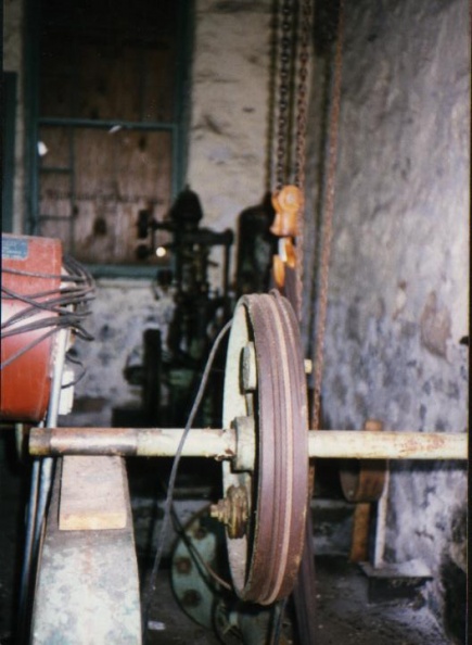 Inside Jordan Powerhouse_ old drive shaft with pully to the Woodward type VR governor_.jpg